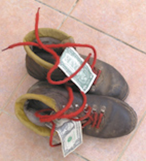 bootstrap startup finance: an illustration showing dollar bills on old boots.